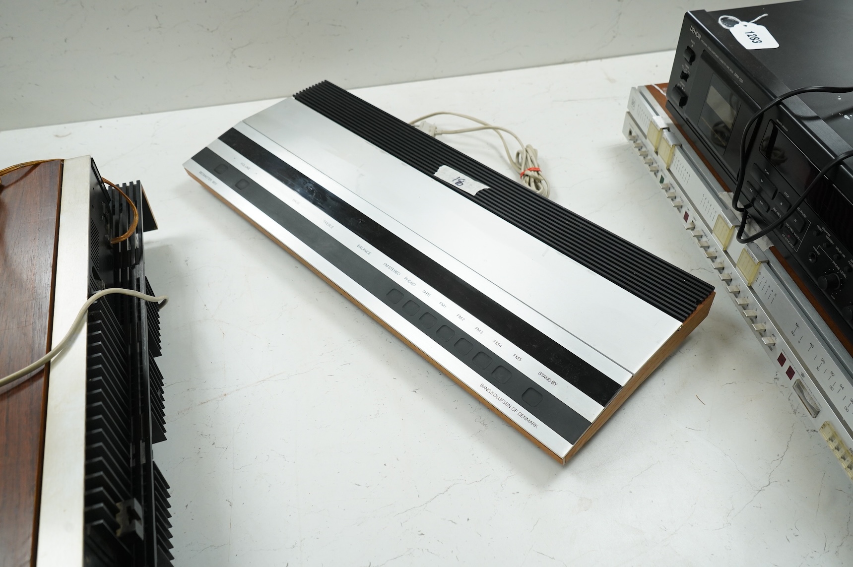 Four Bang & Olufsen stereo items; a Beogram 1000 type 5229 turntable, a Beomaster 4000 type 2406, a Beomaster 901 type 2606, and a Beomaster 1900 type 2903